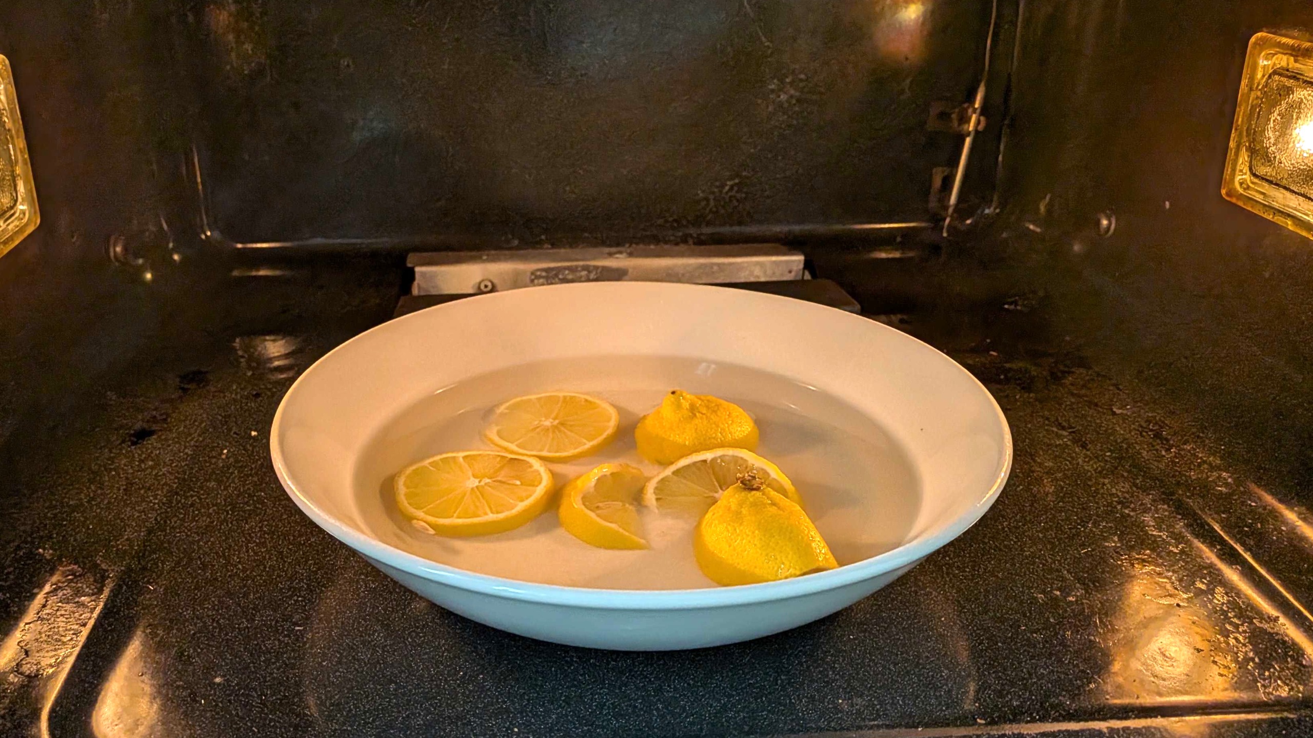 Lemons in bowl inside oven
