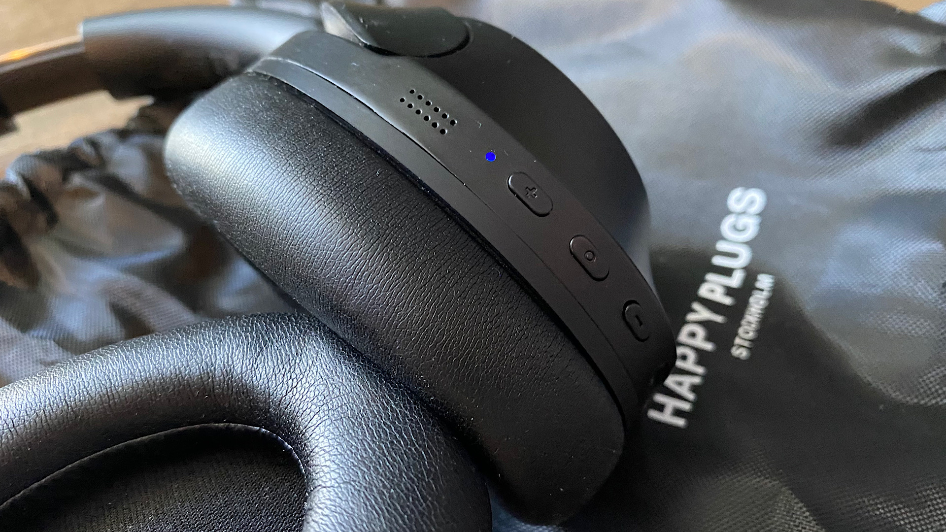 Close up of the control buttons on the earcups of the Happy Plugs Play Pro over-ear headphones