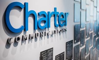 Charter Communications logo on a wall