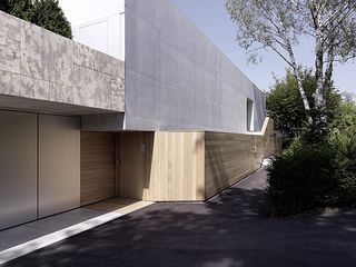 The exterior consists of a mix of materials such as stone, concrete, metal and wood