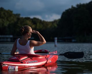 Woman kayaking at Lake Sara Campground, Illinois, USA