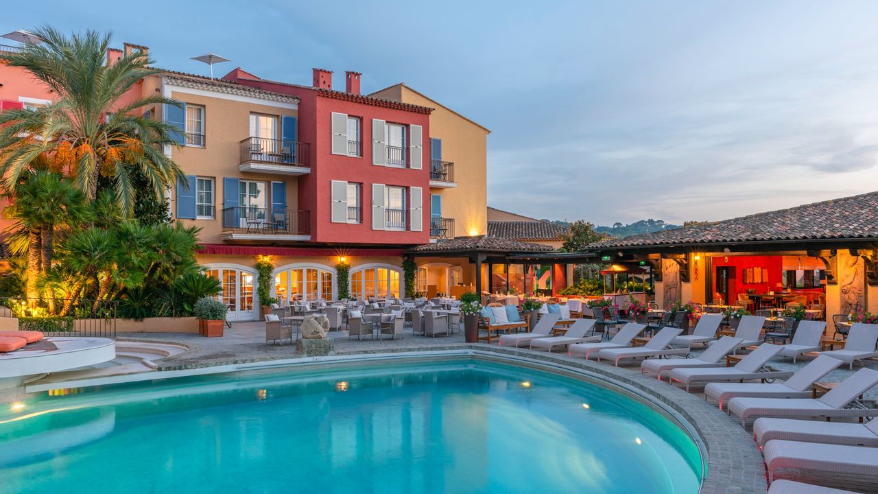 A pool at the Hotel Byblos during dusk