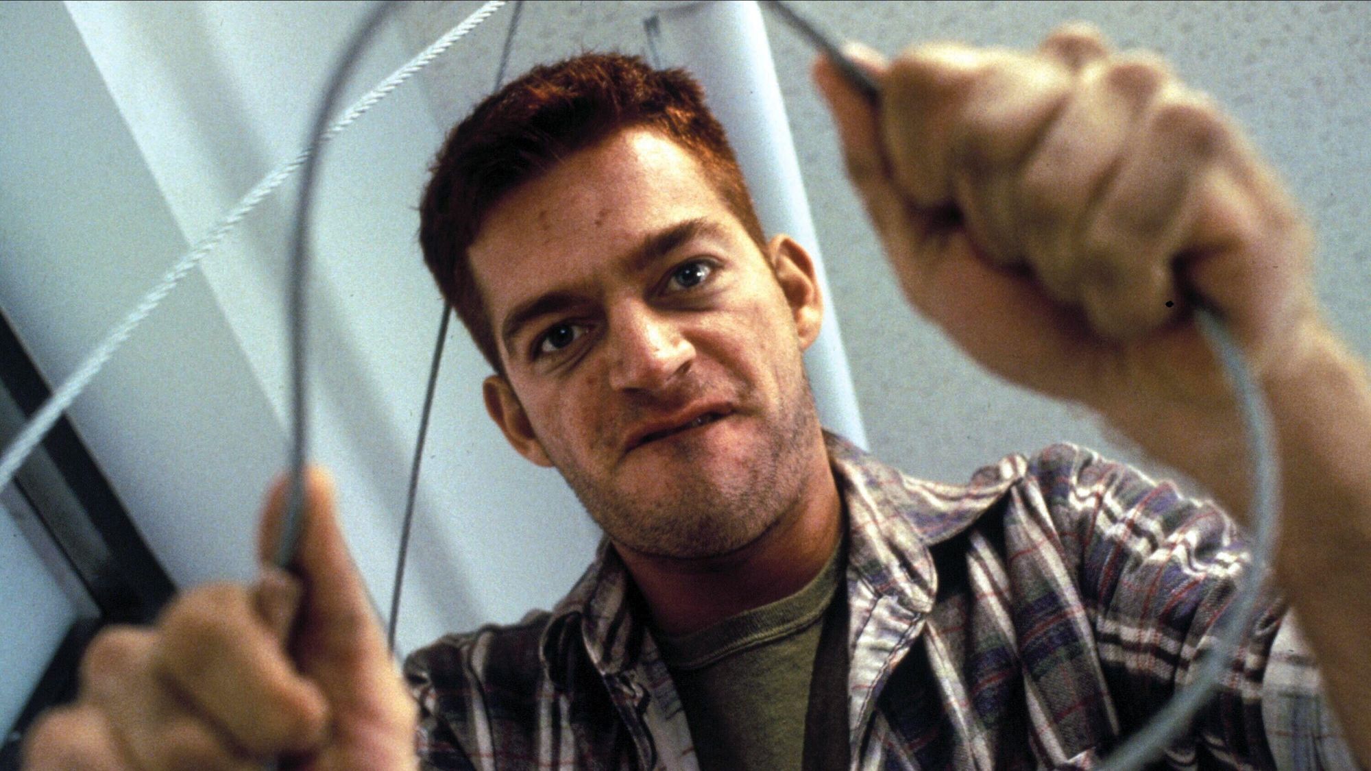 Harry Connick Jr. holding a wire in Copycat