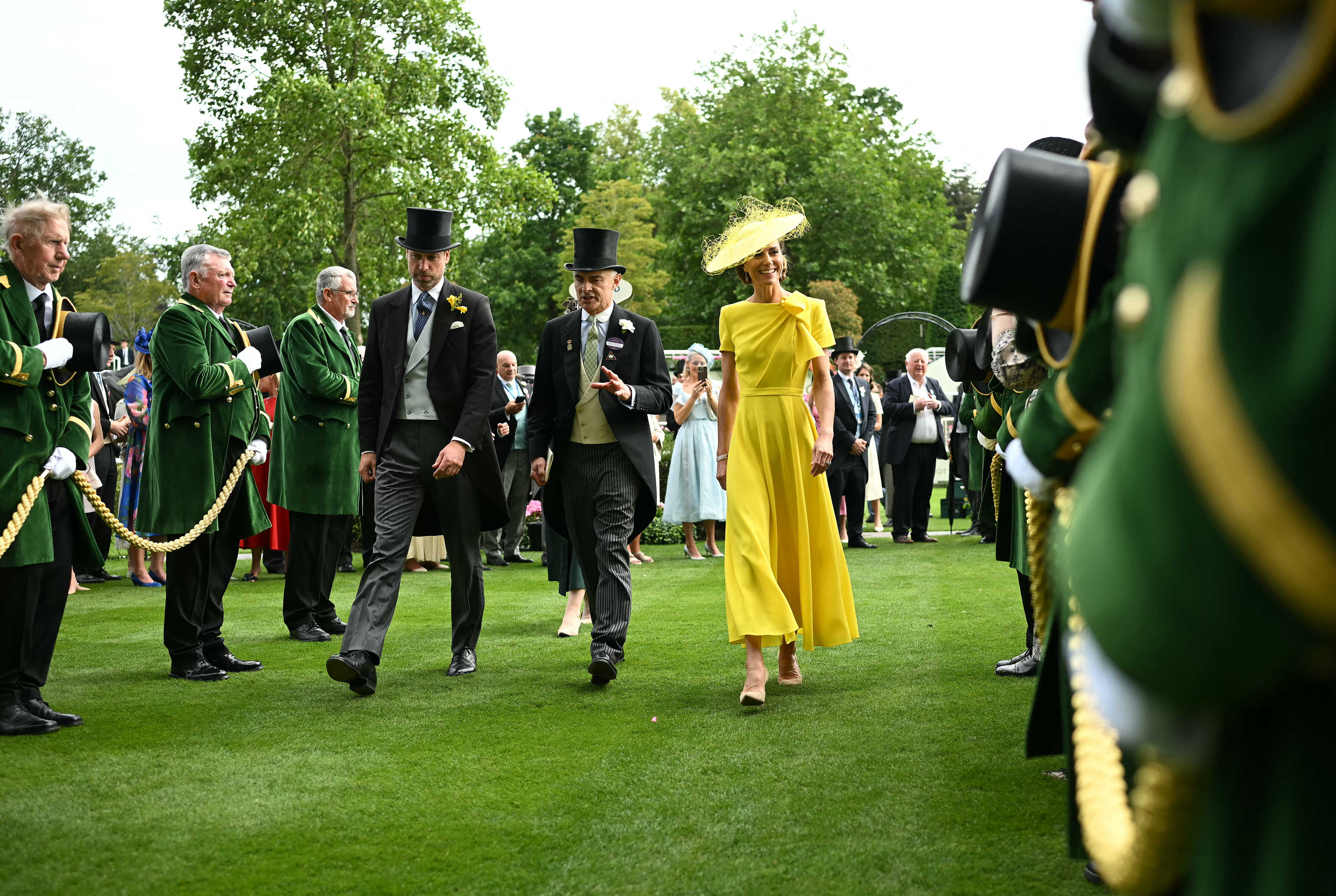 Britain's Prince William, Prince of Wales, Ascot Trustee Henry Morley and Britain's Catherine, Princess of Wales return to the Royal Box after the Prince Of Wales's Stakes horse race trophy presentation on the second day of the Royal Ascot horse racing meeting in Ascot, west of London, on June 17, 2026. (Photo by JUSTIN TALLIS / AFP)