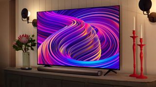 The Vizio Quantum 4K QLED on a shelf in the living room.