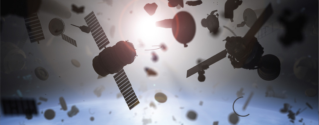 Various pieces of space junk float near the Earth