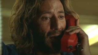 Henry Ian Cusick takes an emotional phone call in Lost.