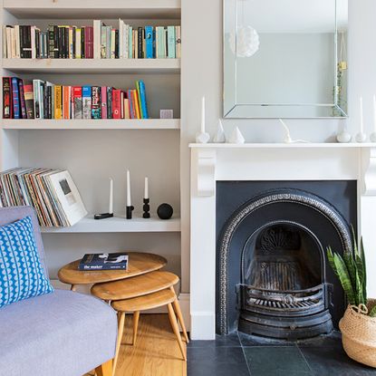 white living rooms with grey armchair