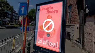 A demonstration of Stijn Spanhove's AR ad block app for use with Snap's Spectacles smart glasses. Marketing material displayed on a roadside billboard is covered by a floating, translucent red box.