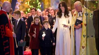 Catherine, Princess of Wales, Prince Louis of Wales, Princess Charlotte of Wales and Prince George of Wales process out of The "Together At Christmas" Carol Service at Westminster Abbey on December 08, 2023