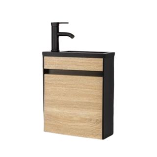 An angled light wooden bathroom vanity with a black waterfall counter and edge and a black faucet