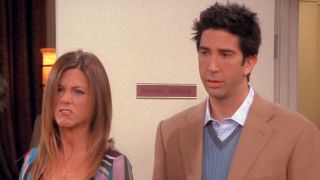 On the Friends Season 9 episode "The One Where Rachel Goes Back to Work," Rachel (Jennifer Aniston) snarls at Gavin (not shown) while Ross (David Schwimmer) stands by. The nameplate on the door behind them reads "Rachel Greene."