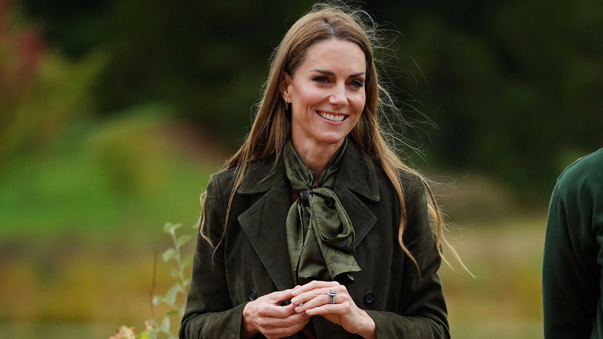 Kate Middleton wears a midi skirt with knee-high boots