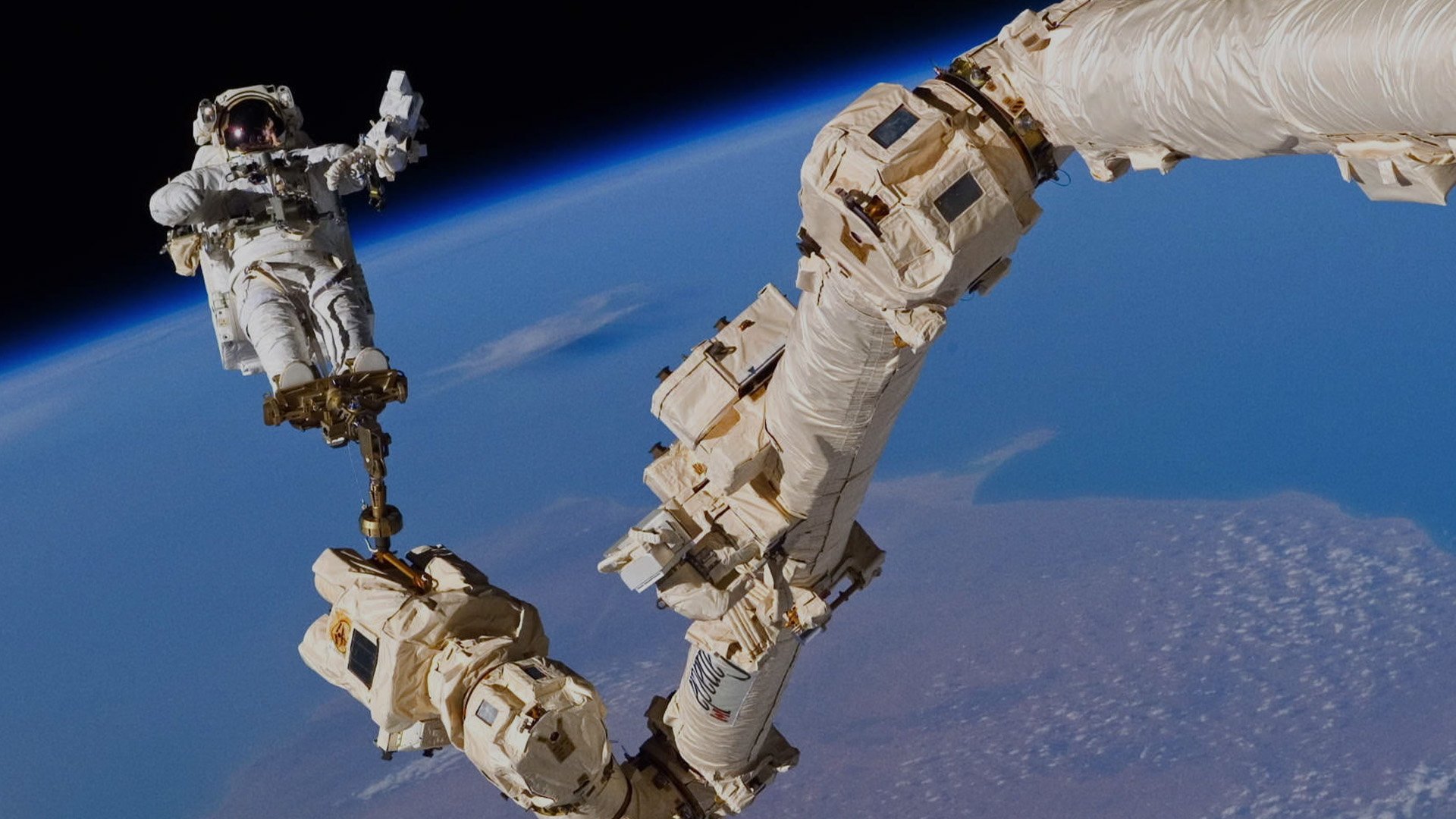 an astronaut on a spacewalk