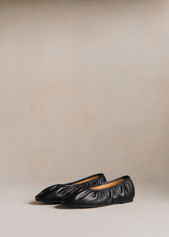 An image of black ruched ballet flats