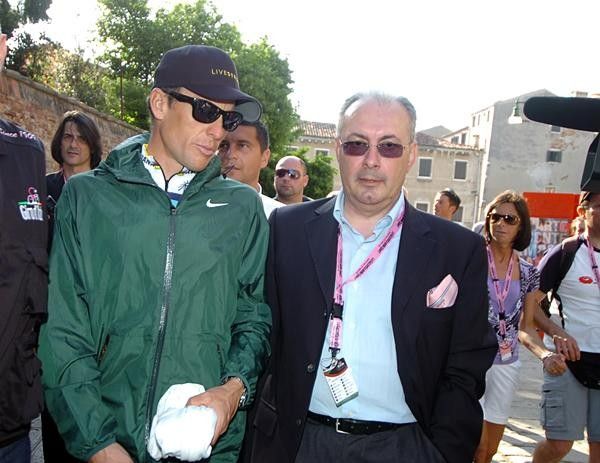 Lance Armstrong walks with Angelo Zomegnan, the Giro organiser.