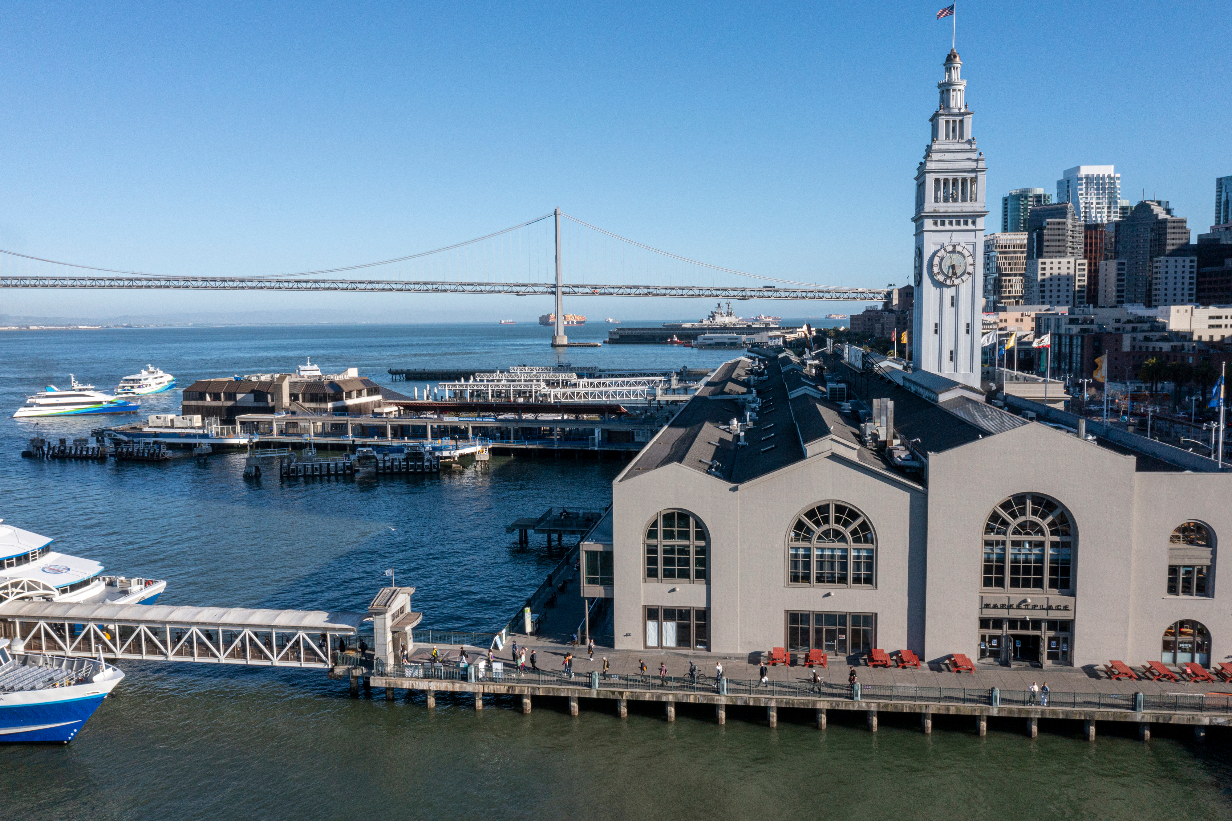 The Ferry Building in San Francisco with the Bay Bridge behind it