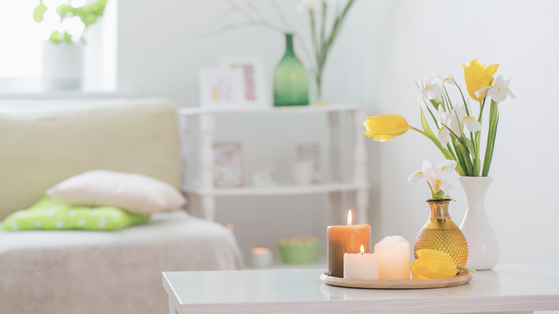picture of candles on tray with vase of spring flowers in living room