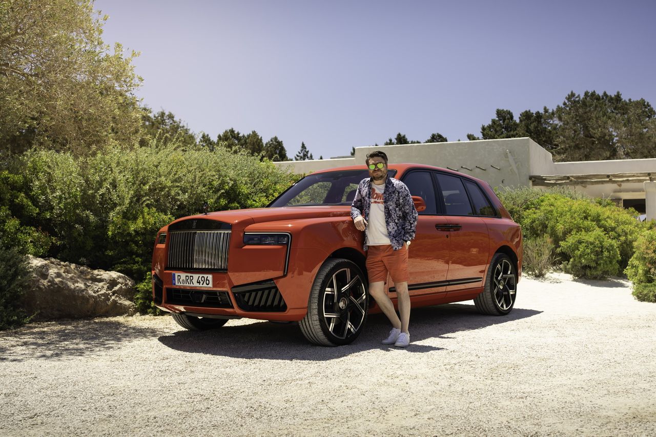 The author basking in the Ibiza sunshine next to the new Cullinan.