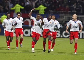 Lyon players celebrate a goal against Werder Bremen in the Champions League in March 2005.