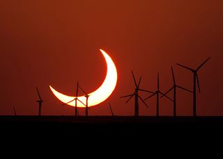 Evan Zucker captured this photo of a partially eclipsed setting sun on May 20, 2012, just south of Elida, New Mexico. Zucker used a Canon EOS Rebel Xsi camera with a Canon f/5.6 400 mm lens.