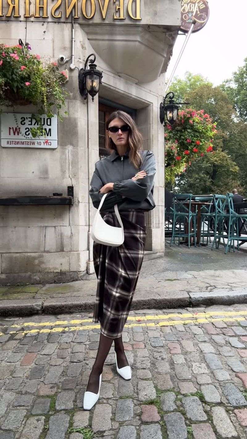 Coco Schiffer wearing a cos checked skirt
