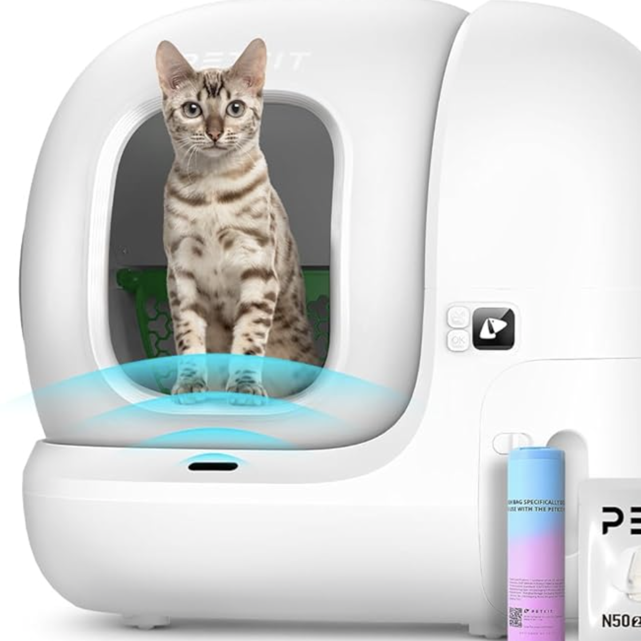 cat using a litter pod