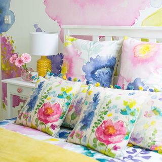 bedroom with beds having floral bedlinen