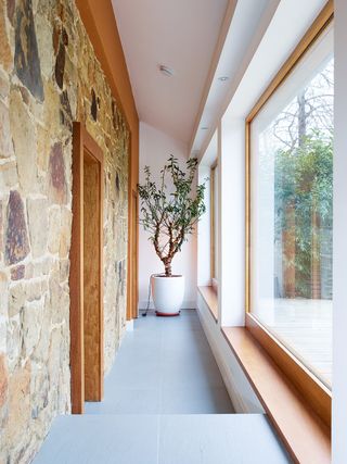 Hallway with retained stone wall