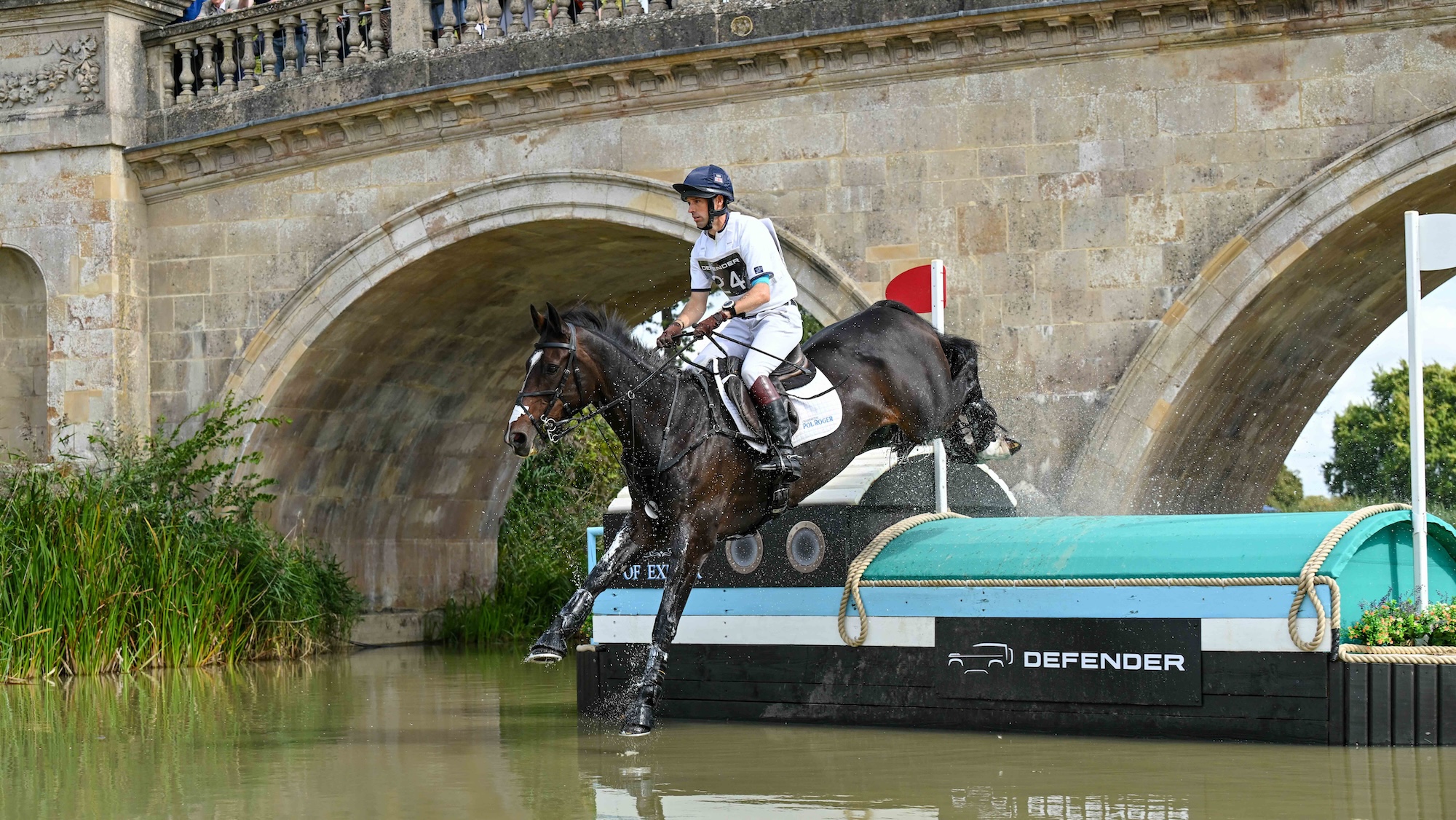 Harry Meade riding CAVALIER CRYSTAL during the cross country phase of the Defender Burghley Horse Trials, in the park land surrounding Burghley House near Stamford in Lincolnshire in 2025