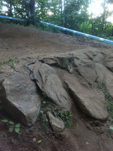 A rock drop off on the downhill course