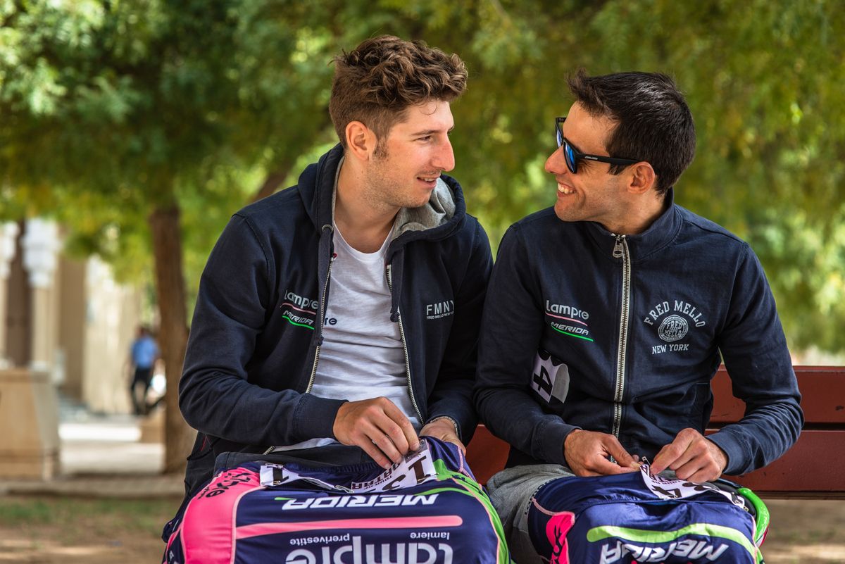 Sacha Modolo and Mario Costa chat as they pin on their race numbers