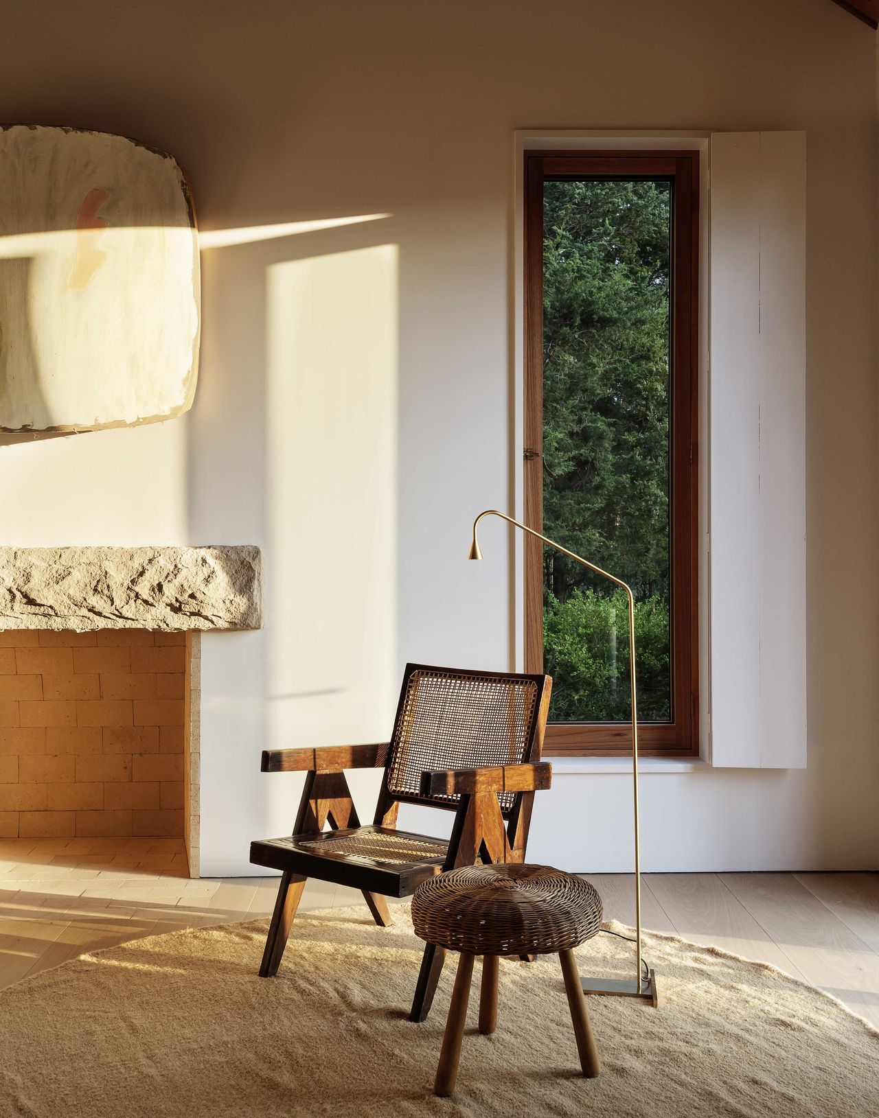 Warm minimal bedroom with neutral scheme, slender windows and modern shutters