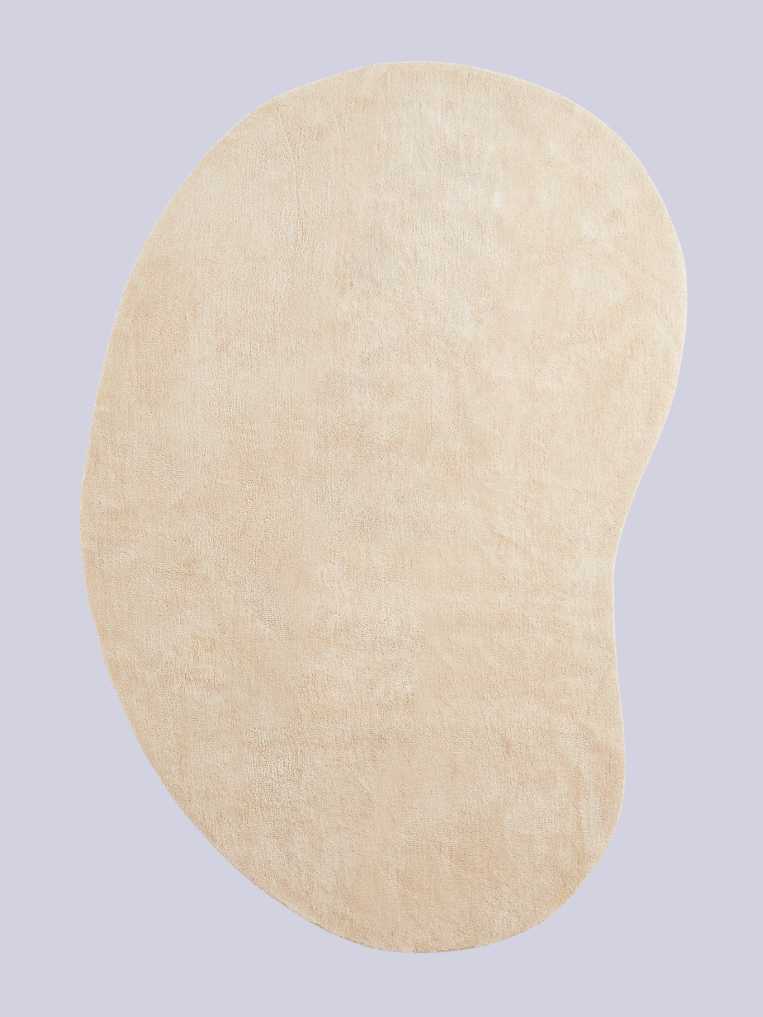 An irregular light beige asymmetric rug from H&amp;amp;M
