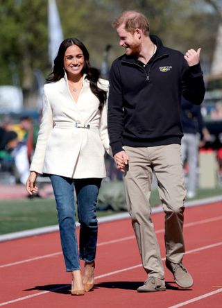 Prince Harry, Duke of Sussex and Meghan, Duchess of Sussex attend the Athletics Competition during day two of the Invictus Games in 2022