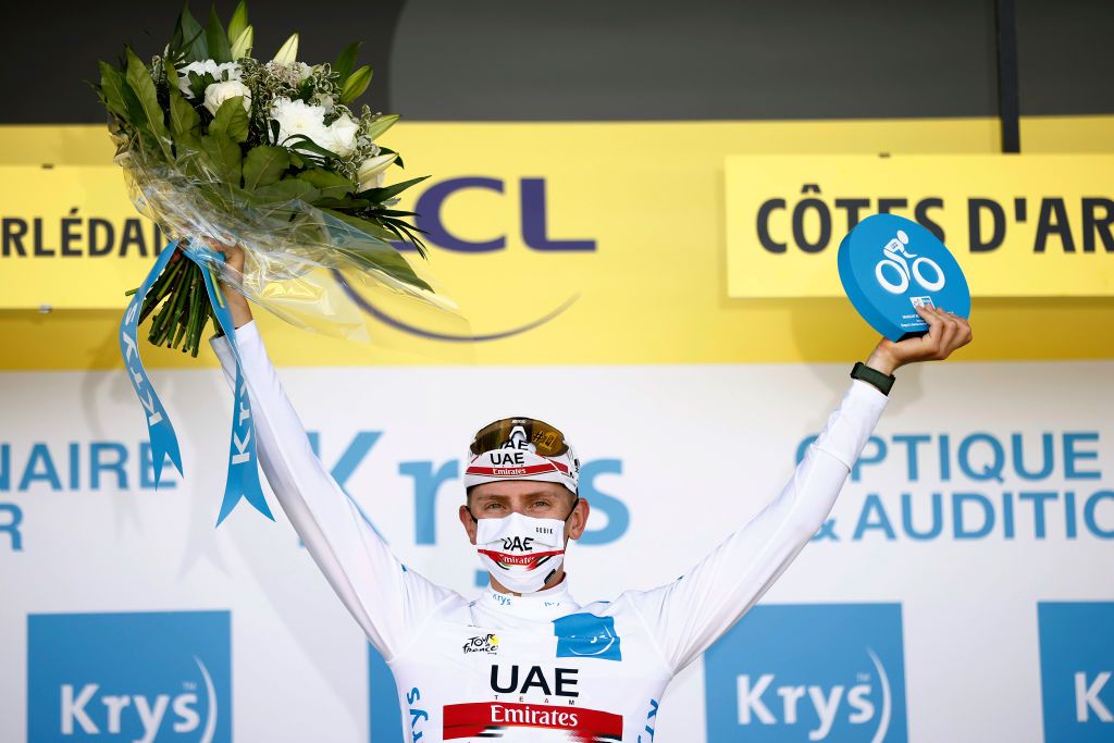 MRDEBRETAGNE GUERLDAN FRANCE JUNE 27 Tadej Pogacar of Slovenia and UAETeam Emirates white best young jersey celebrates at podium during the 108th Tour de France 2021 Stage 2 a 1835km stage from PerrosGuirec to MrdeBretagne Guerldan 293m LeTour TDF2021 on June 27 2021 in MrdeBretagne Guerldan France Photo by Stephane Mahe PoolGetty Images