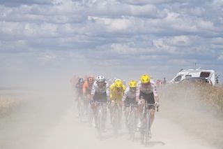 Tadej Pogacaer and his team on the gravel at the Tour de France 2024