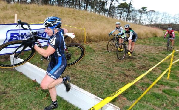 Laura Van Gilder (C-3 Althletes Serving Athletes) leading the chasers over the barriers