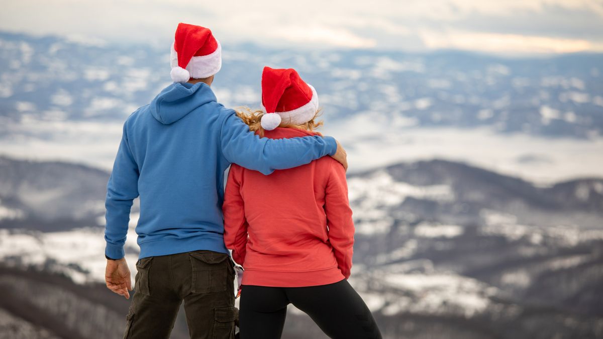 best gifts for hikers: hikers wearing Christmas hats