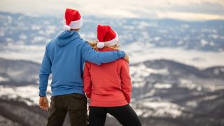 best gifts for hikers: hikers wearing Christmas hats
