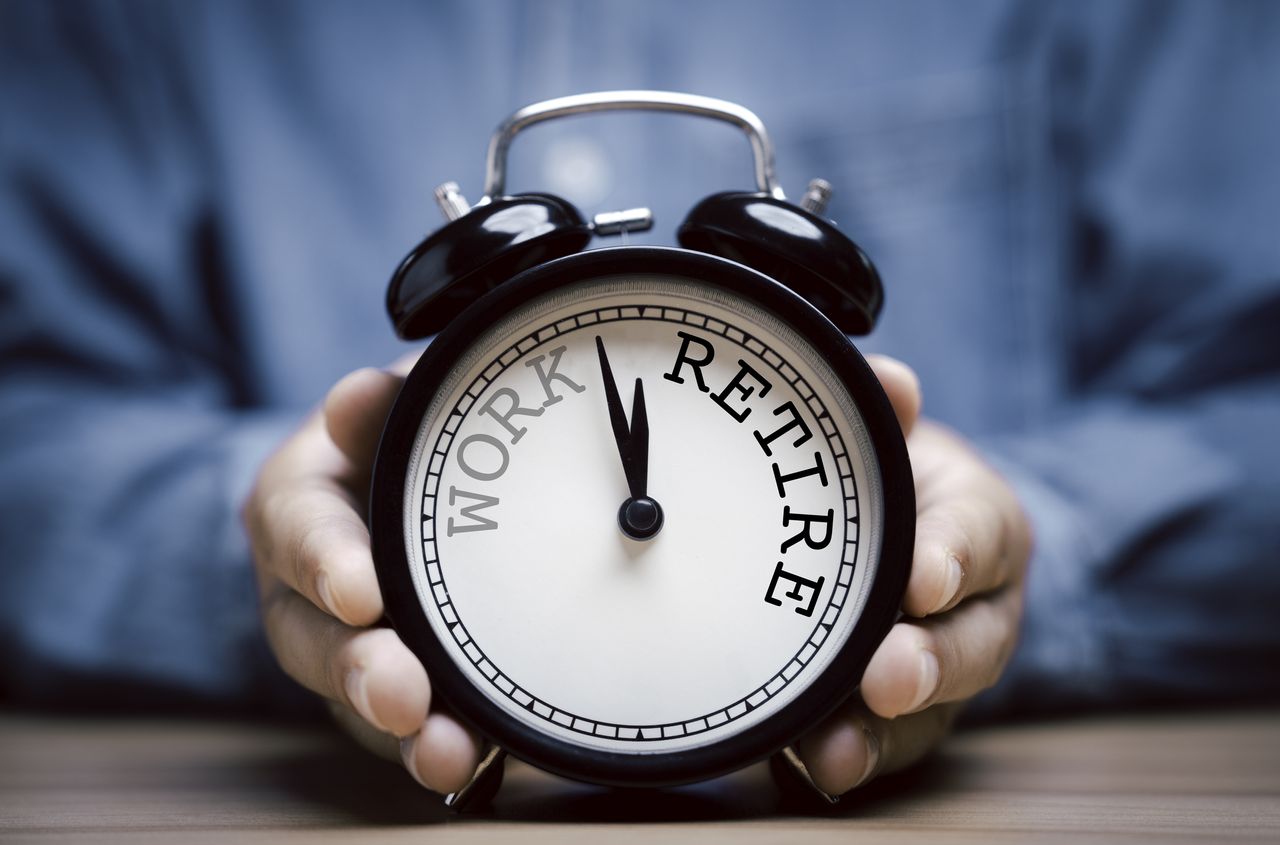 Workplace pension decisions represented by a clock ticking from work towards retirement (image: Getty Images)