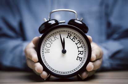 Workplace pension decisions represented by a clock ticking from work towards retirement (image: Getty Images)