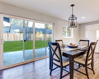Dining room with sliding glass doors and wooden table