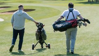 Golfers Walking On The Course