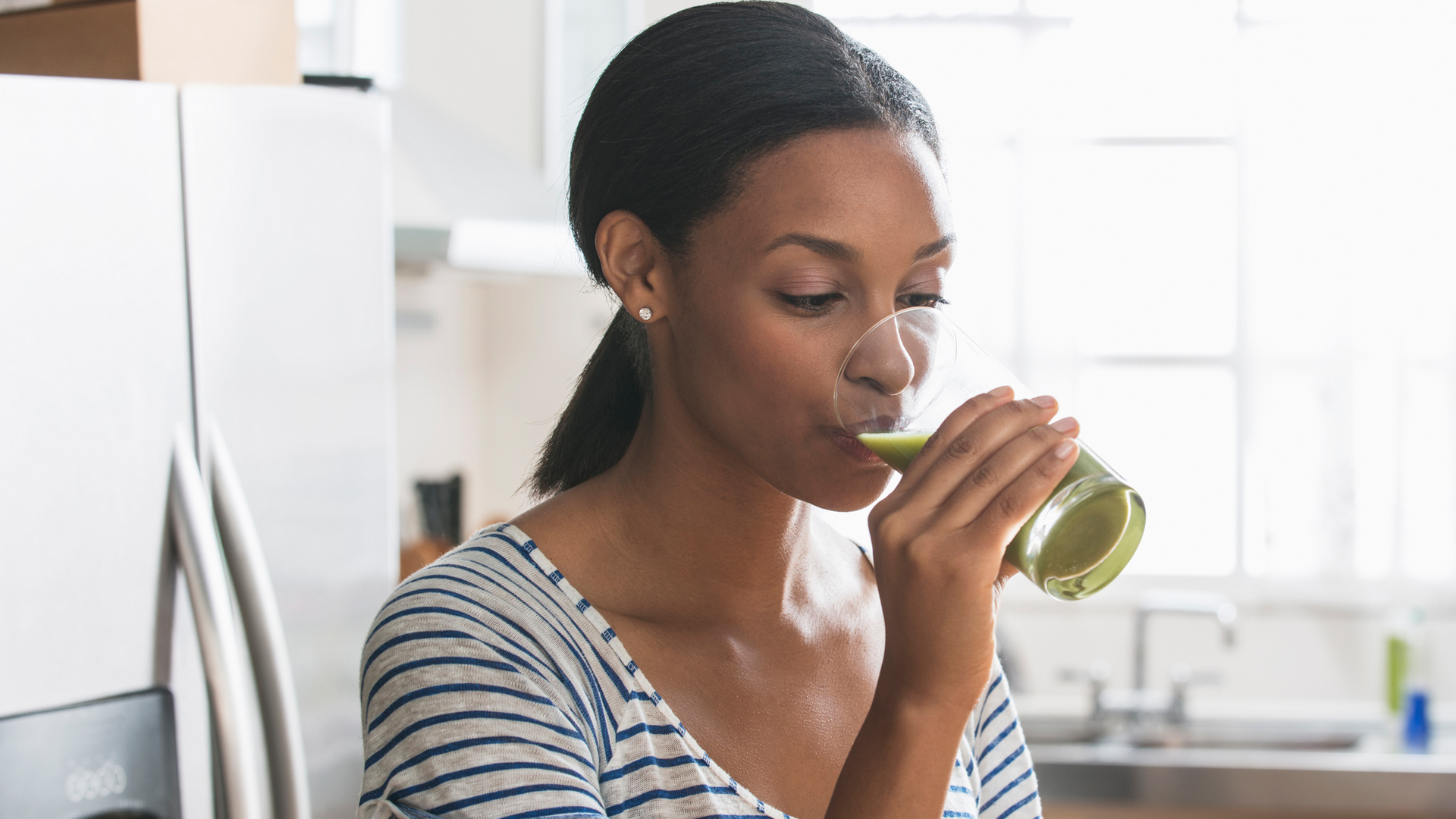 woman drinking a meal replacement shake