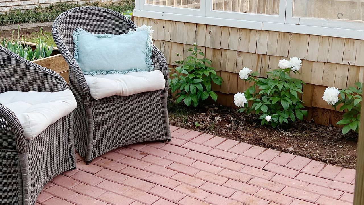 A DIY brick patio with armchairs