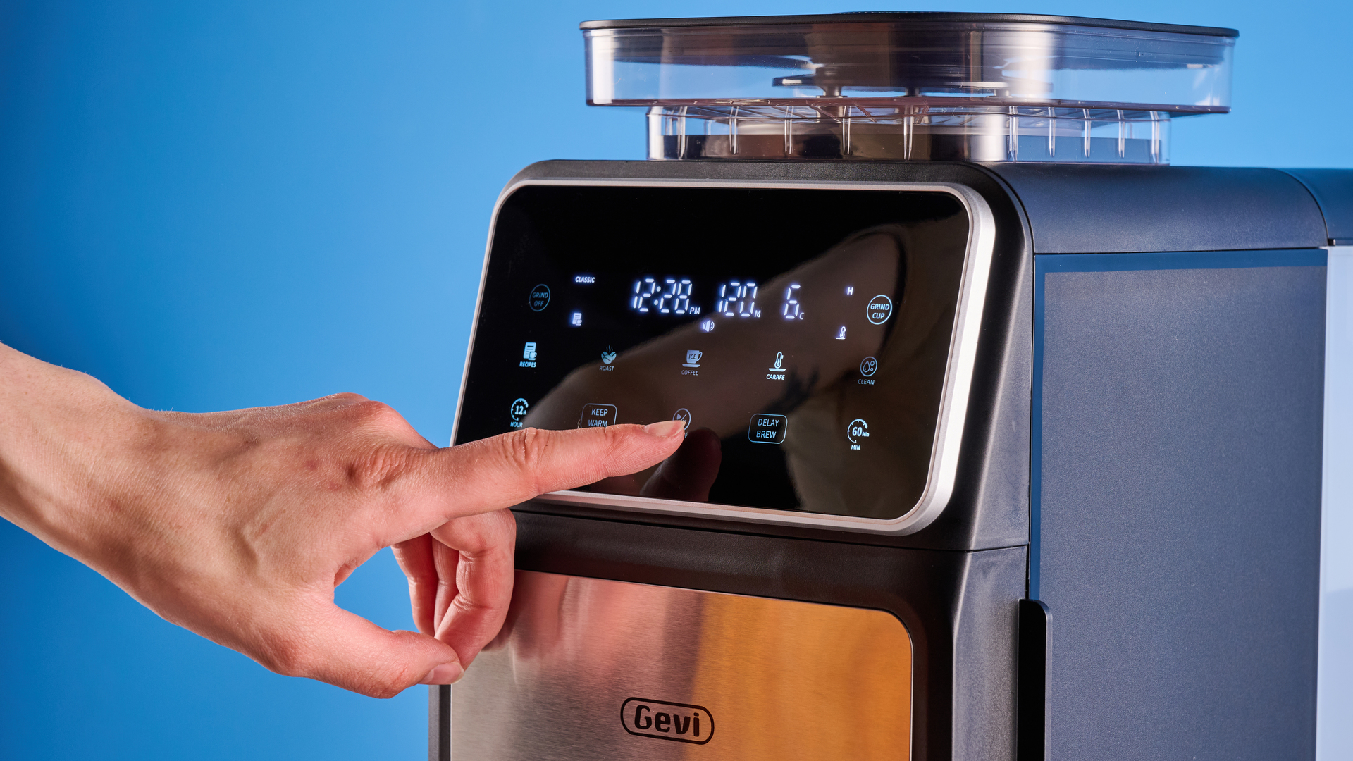 the gevi 10-cup drip coffee maker with grinder photographed against a blue background, showing the glass carafe, water tank, touch screen, and accessories including plastic filter