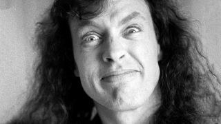 Angus Young grinning in close-up