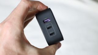 Ugreen Nexode 65W charger ports close up held in a hand