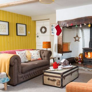 living room with white wall and fireplace